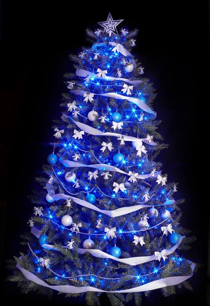 Christmas tree with light and blue star.