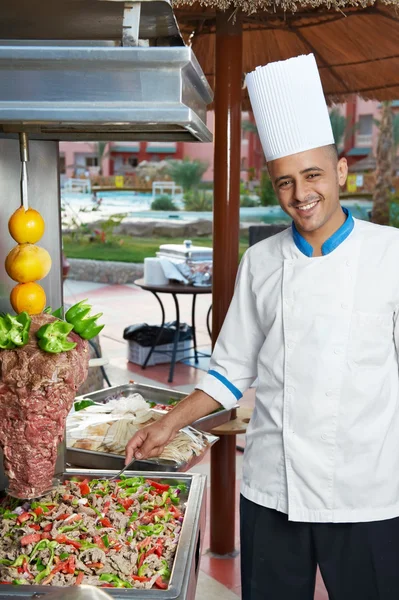 Arab chef making kebab