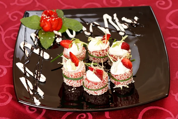 Tiramisu Sushi Roll garnished with Strawberry and Mint