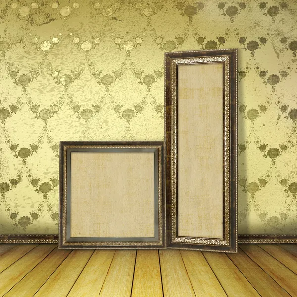 Wooden frames in the old room with the remains former luxury