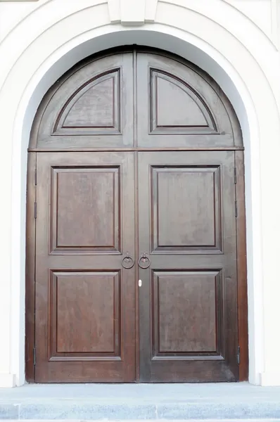 Massive Arched Wood Doors — Stock Photo #7891686
