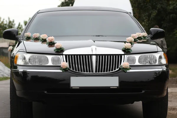 Decorated wedding limousine from the front