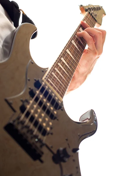 Hand playing electric guitar