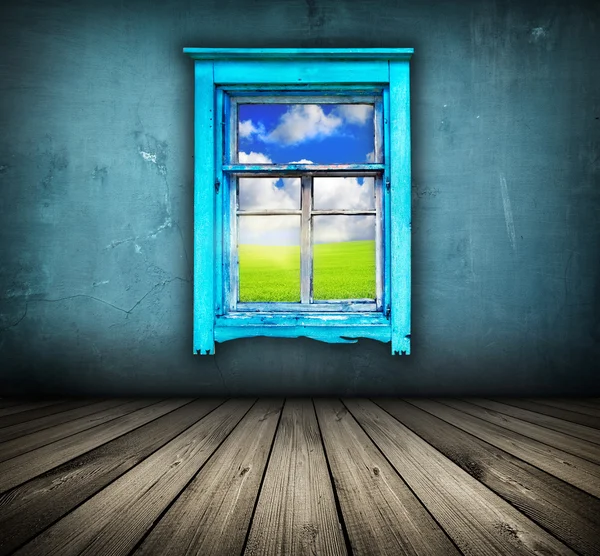 Blue room with wooden floor and window with field and sky above
