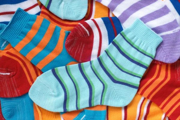 Many pairs of child\'s striped socks