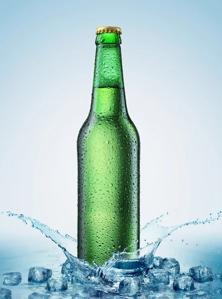 Beer bottle being poured in a water