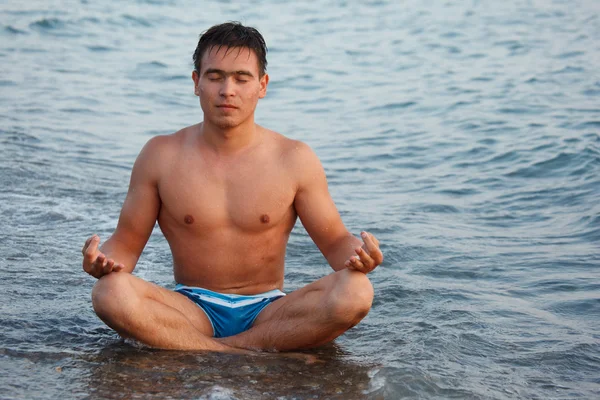Young man meditating
