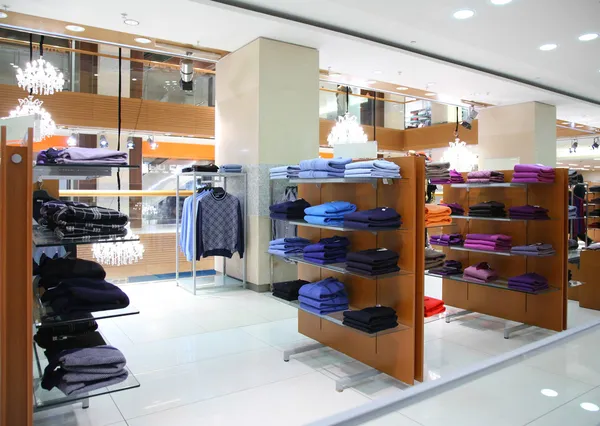 Clothing on shelfs in store