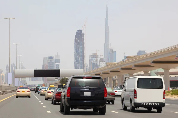 DUBAI - APRIL 18: general view on trunk road with many cars, sky