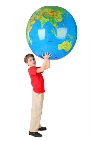 Boy in red shirt holding big inflatable globe over his head side
