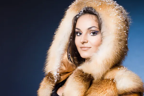 Beautiful woman in a fur coat