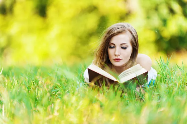 Woman grass reading book