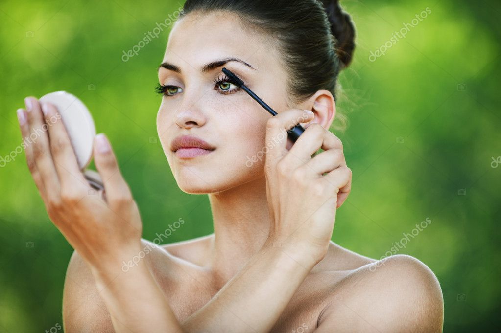 Naked woman attractive looks mirror dye eyelashes background summer green Naked woman attractive looks mirror dye eyelashes background summer green