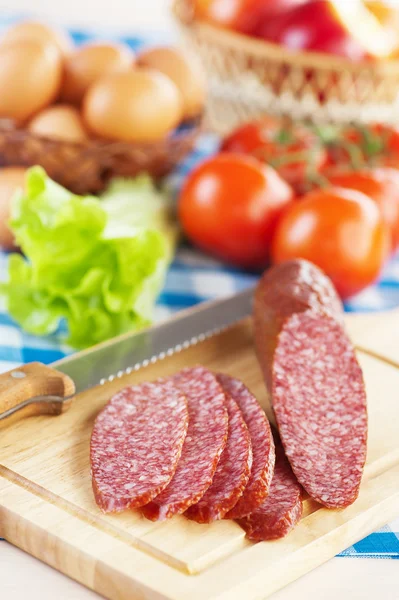 Range products (sausage salami, lettuce, tomatoes, eggs, apples)