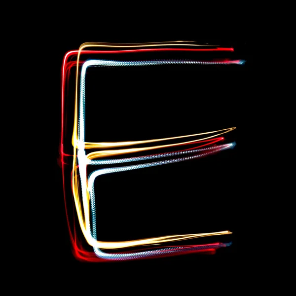Letter E made from brightly coloured neon lights