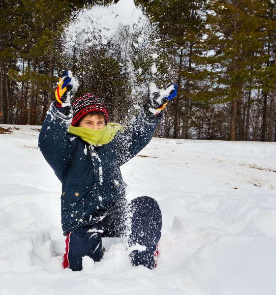 Happy child playing with snow by Xalanx - Stock Photo