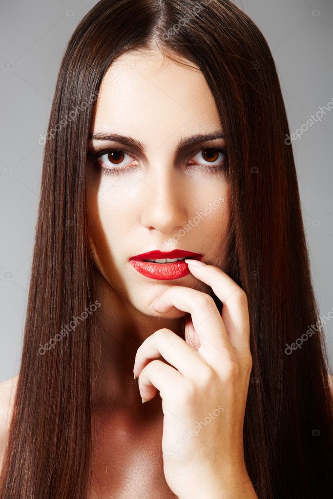 Portrait of woman model with red lips Fashion hairstyle with smooth long