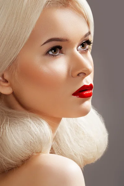Doll style. Sensual woman model with fashion bright red lips make-up