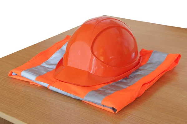 Yellow high visibility vest and protective helmet