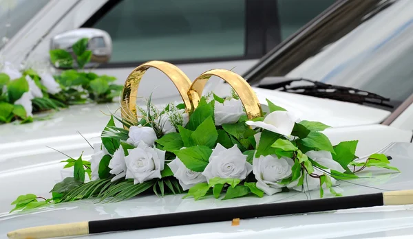 Beautiful floral decoration is on a wedding car