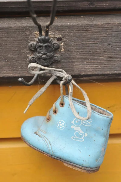 Old baby shoes as wall decoration