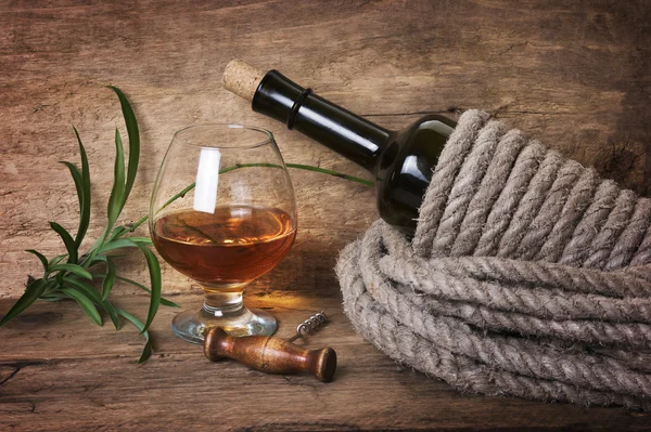 Bottle of wine wrapped with rope
