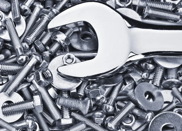 Chrome spanner, nuts and bolts useful as a background
