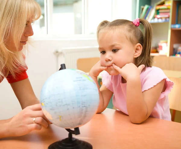 Little girl at geography lesson