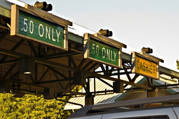 Signs at a Toll Booth