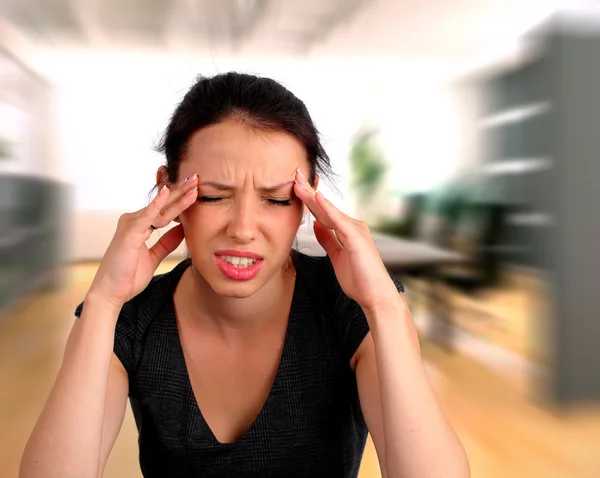 Woman heaving a headache