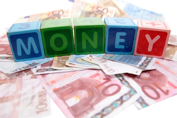 Money in toy play block letters