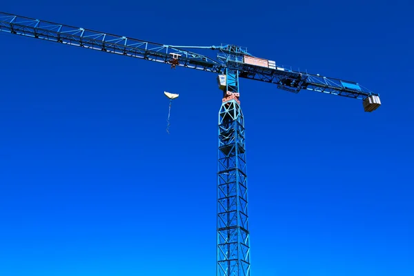Mobile crane against urban place