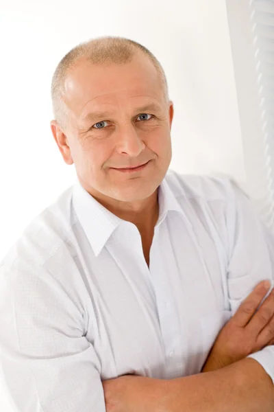 Mature businessman smile cross arms posing by CandyBoxImages Stock Photo