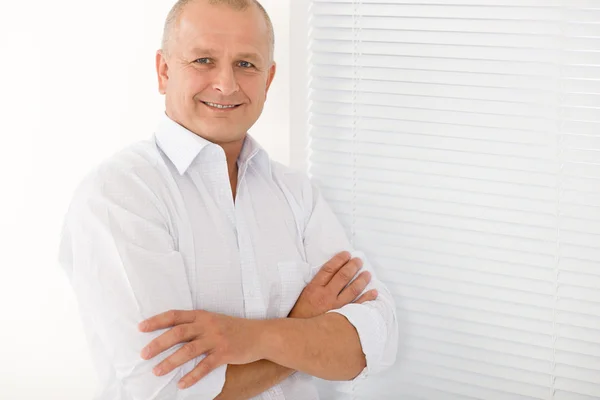 Mature businessman smile cross arms posing by CandyBoxImages Stock Photo