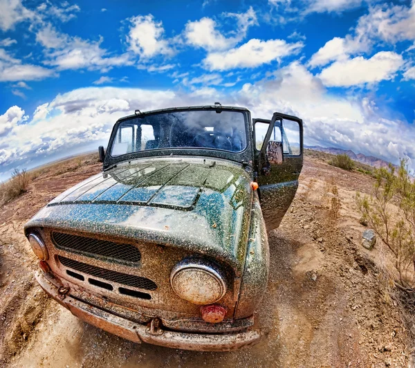 Dirty jeep in desert