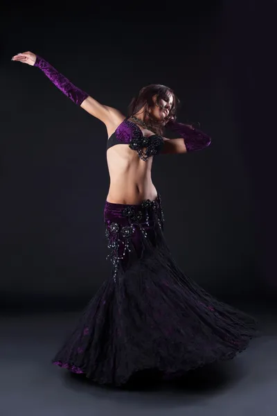 Beauty girl in oriental purple arabic costume