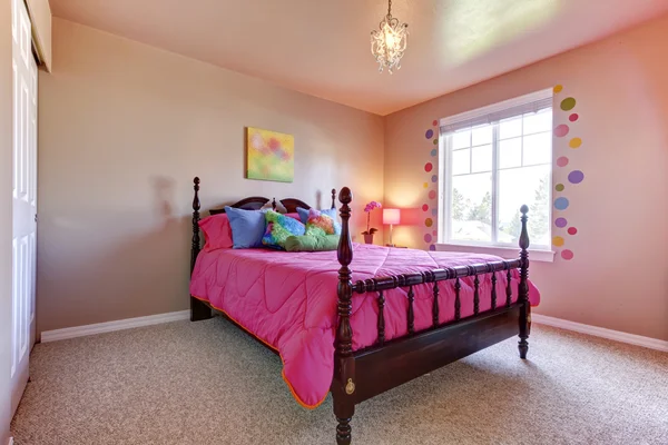 Pink girls bedroom with cute bed