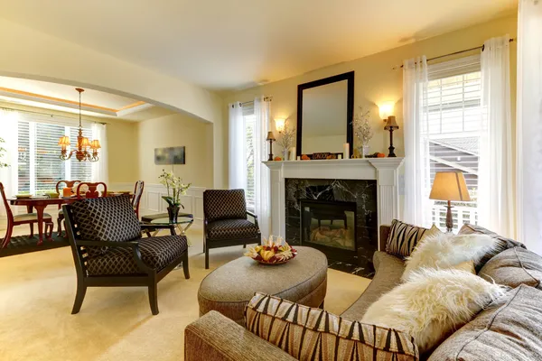 Elegent large golden living room with fireplace