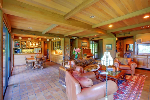 Large living room on the horse ranch with the kitchen.