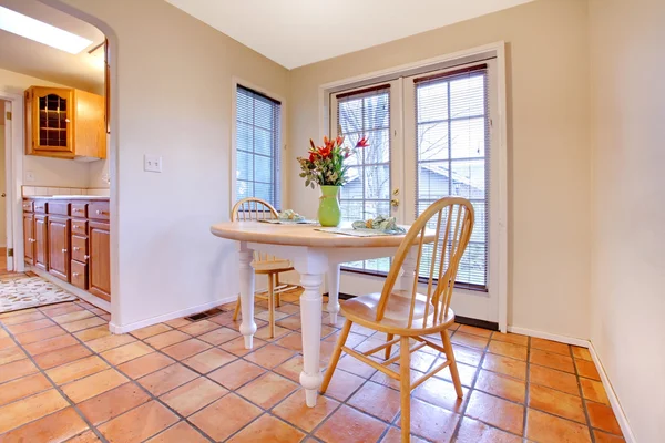 Happy dining room with orange tile floor
