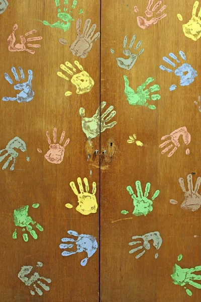 Colorful hands on wardrobe