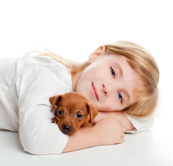 Blond kid girl with mini pinscher pet mascot dog