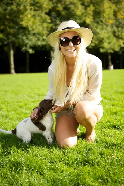 Sexy Blonde Woman With Puppy