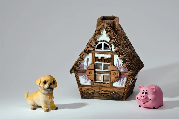 Souvenirs. A dog, a pig and a small house.
