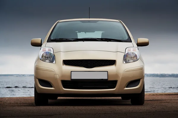 Front view of a beige car