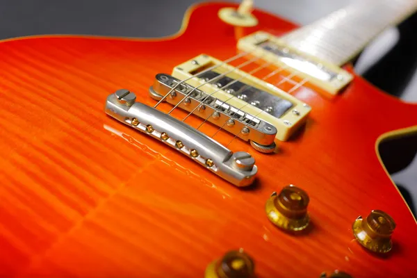 Close-up of red electric guitar