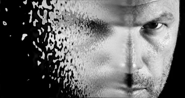 Sci fi looking image of man\'s face seeming to shatter and blow a