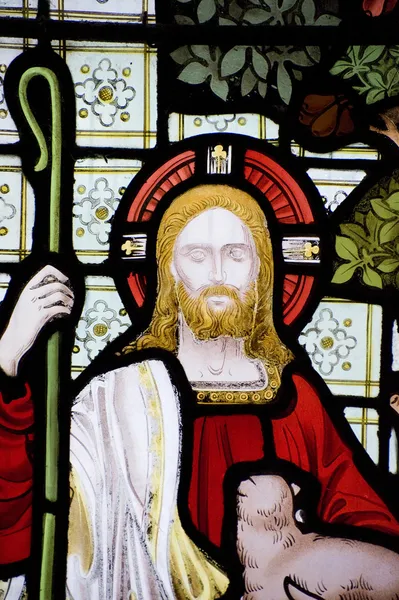Detail of stained glass religious window in church