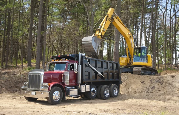 Dump truck and excavator