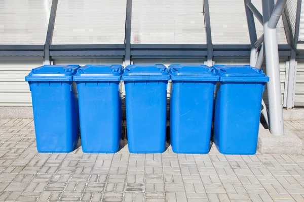 Blue plastic recycling bins